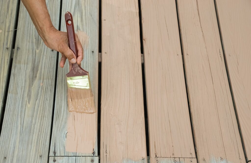 wooden deck panels being painted beige