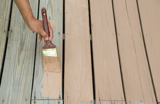 wooden deck panels being painted beige
